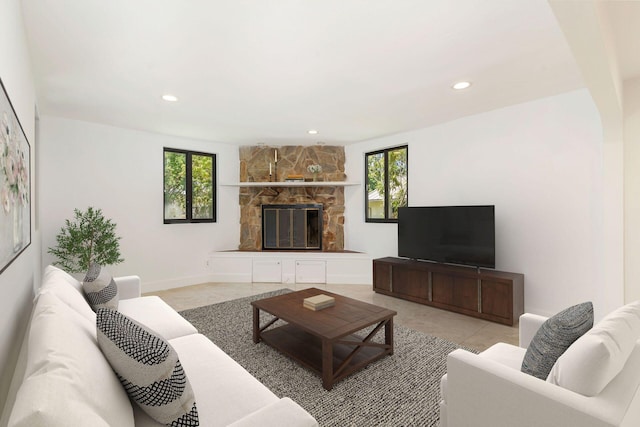 living area with healthy amount of natural light, a fireplace, tile patterned floors, and recessed lighting