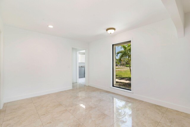 unfurnished room with baseboards, light tile patterned floors, and recessed lighting