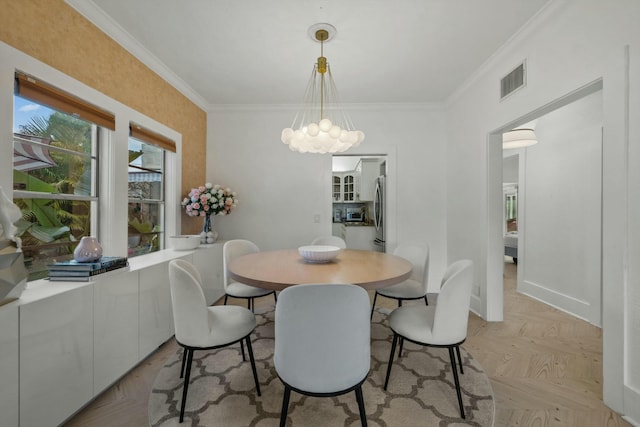 951 Selkirk St, West Palm Beach, FL 33405 - dining room featuring crown molding, an inviting chandelier, and visible vents