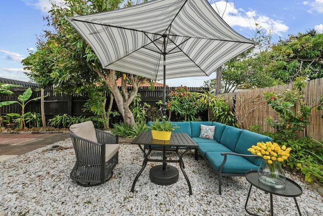 951 Selkirk St, West Palm Beach, FL 33405 - view of patio with a fenced backyard and an outdoor hangout area