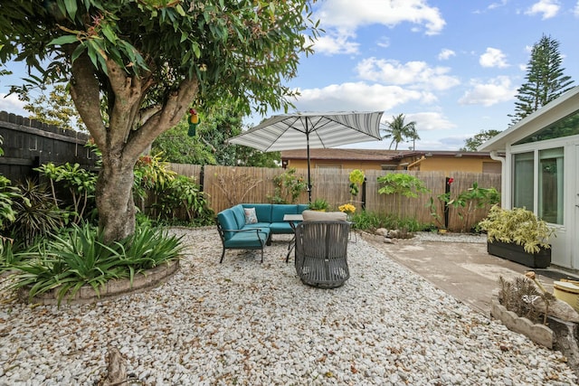951 Selkirk St, West Palm Beach, FL 33405 - view of patio featuring a fenced backyard and an outdoor hangout area
