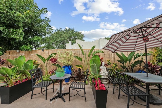 951 Selkirk St, West Palm Beach, FL 33405 - view of patio featuring a fenced backyard and outdoor dining area
