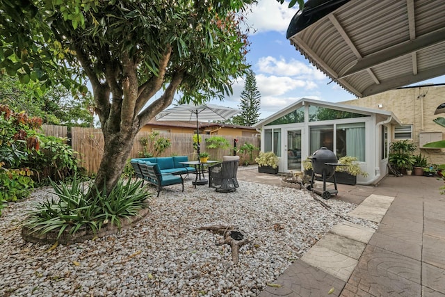 951 Selkirk St, West Palm Beach, FL 33405 - view of patio featuring fence, grilling area, and an outdoor hangout area