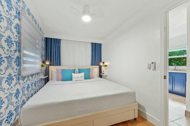951 Selkirk St, West Palm Beach, FL 33405 - bedroom featuring a ceiling fan, baseboards, and a sink