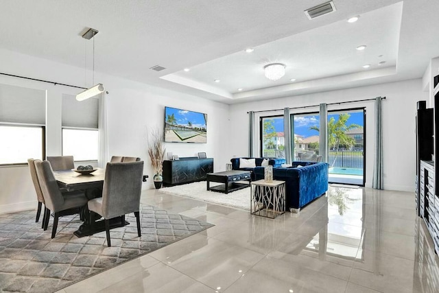 12170 N Baypoint Cir, Parkland, FL 33076 - dining space with recessed lighting, visible vents, baseboards, and a tray ceiling
