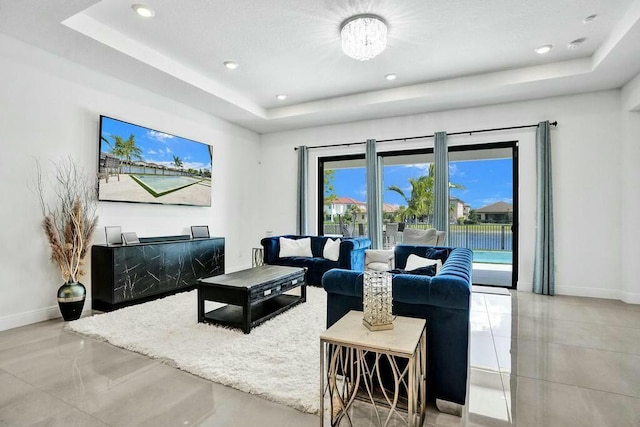 12170 N Baypoint Cir, Parkland, FL 33076 - living area featuring recessed lighting, a tray ceiling, and baseboards