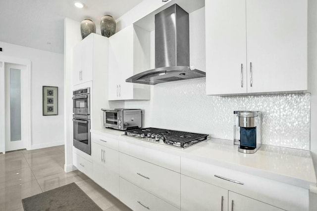 12170 N Baypoint Cir, Parkland, FL 33076 - kitchen featuring light countertops, stainless steel appliances, decorative backsplash, and wall chimney exhaust hood