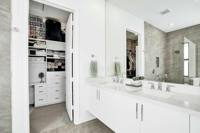 12170 N Baypoint Cir, Parkland, FL 33076 - full bath featuring double vanity, visible vents, a stall shower, and a sink