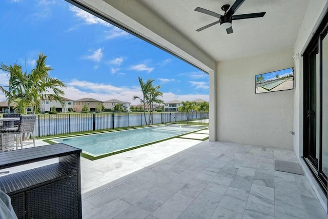 12170 N Baypoint Cir, Parkland, FL 33076 - view of swimming pool with a ceiling fan, a water view, a patio, and a fenced backyard
