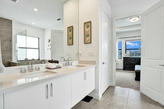 12170 N Baypoint Cir, Parkland, FL 33076 - full bath featuring tile patterned floors, visible vents, double vanity, and a sink