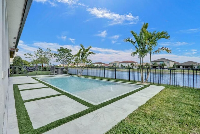 12170 N Baypoint Cir, Parkland, FL 33076 - view of swimming pool with a fenced backyard, a water view, and a fenced in pool