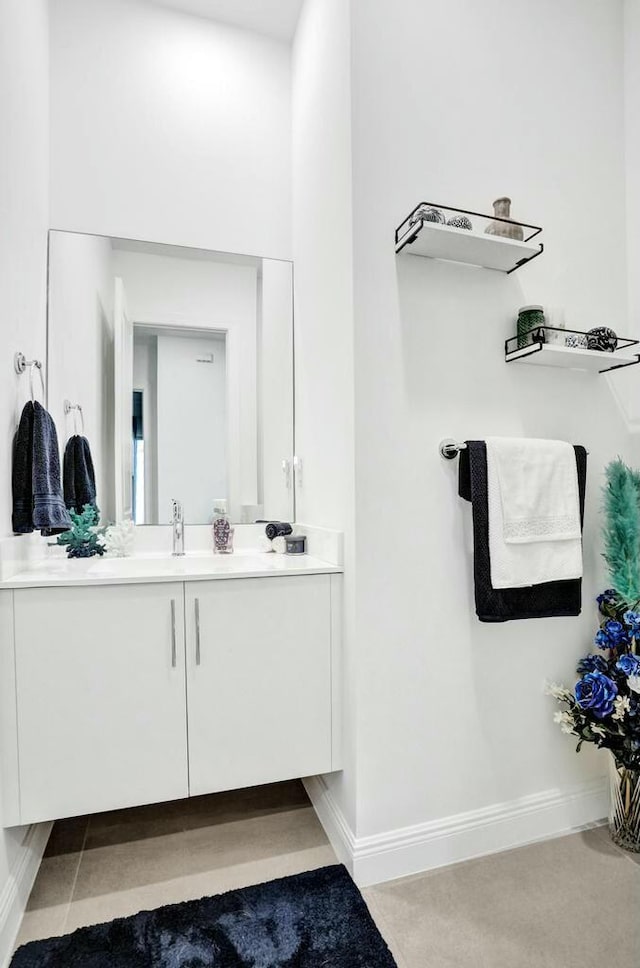 12170 N Baypoint Cir, Parkland, FL 33076 - bathroom featuring baseboards and vanity
