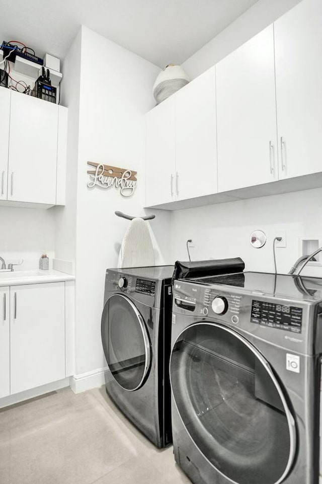12170 N Baypoint Cir, Parkland, FL 33076 - laundry area featuring baseboards, cabinet space, and washing machine and dryer