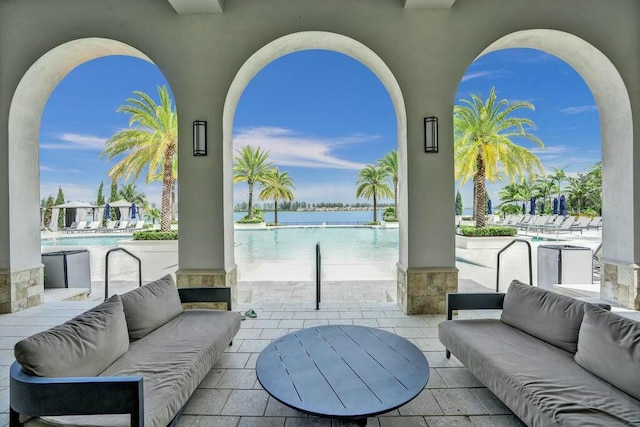 12170 N Baypoint Cir, Parkland, FL 33076 - view of patio featuring a water view, outdoor lounge area, and a community pool