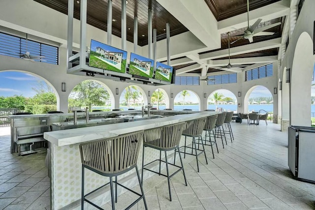 12170 N Baypoint Cir, Parkland, FL 33076 - view of patio with exterior kitchen, a ceiling fan, and outdoor wet bar