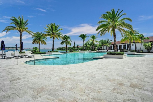 12170 N Baypoint Cir, Parkland, FL 33076 - community pool with a patio area