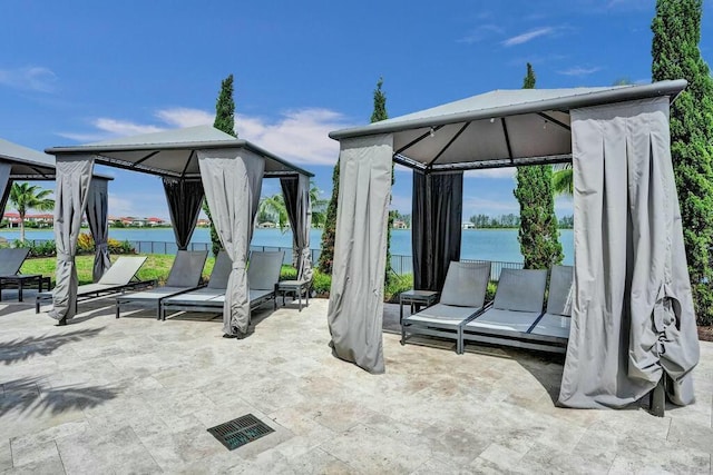 12170 N Baypoint Cir, Parkland, FL 33076 - view of patio featuring visible vents, a gazebo, and a water view