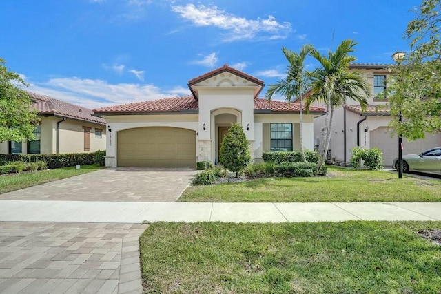 12170 N Baypoint Cir, Parkland, FL 33076 - mediterranean / spanish-style house with a front yard, stucco siding, driveway, a tiled roof, and an attached garage