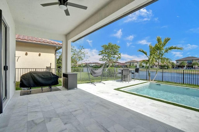 12170 N Baypoint Cir, Parkland, FL 33076 - view of pool featuring a fenced in pool, ceiling fan, a water view, a fenced backyard, and area for grilling