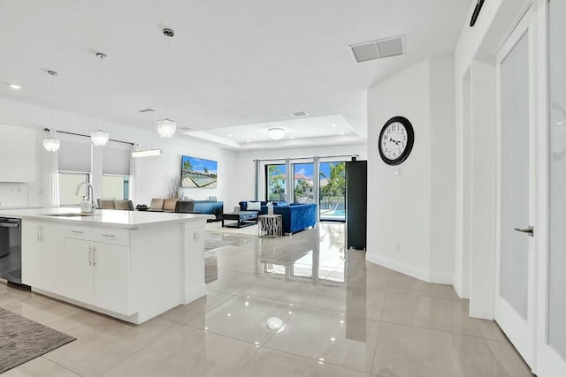 12170 N Baypoint Cir, Parkland, FL 33076 - kitchen featuring visible vents, open floor plan, white cabinets, and a sink