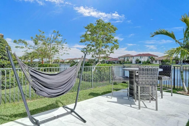 12170 N Baypoint Cir, Parkland, FL 33076 - view of patio / terrace featuring fence, a residential view, and outdoor dry bar