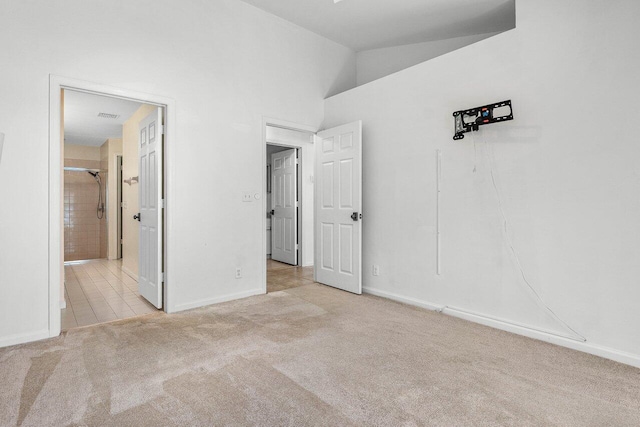 3803 S Lancewood Pl, Delray Beach, FL 33445 - unfurnished bedroom with carpet floors, visible vents, lofted ceiling, baseboards, and ensuite bath
