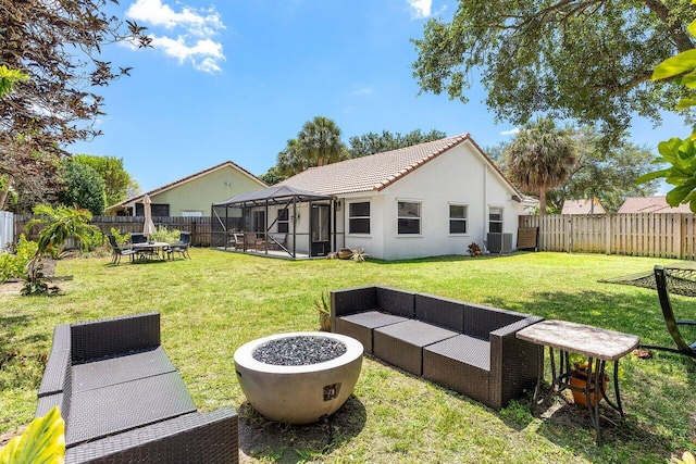 3803 S Lancewood Pl, Delray Beach, FL 33445 - back of house with a fenced backyard, a lawn, stucco siding, and cooling unit