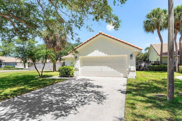 3803 S Lancewood Pl, Delray Beach, FL 33445 - mediterranean / spanish-style house featuring fence, a front lawn, and a tile roof