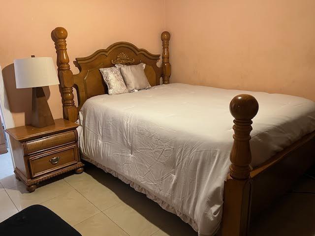 1164 NW 45th Ave, Lauderhill, FL 33313 - bedroom with light tile patterned floors