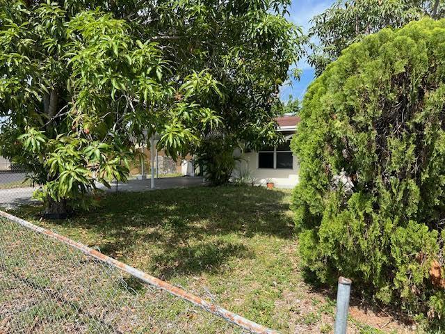 1164 NW 45th Ave, Lauderhill, FL 33313 - view of yard featuring fence