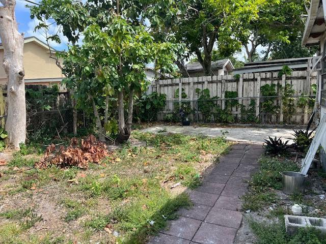 1164 NW 45th Ave, Lauderhill, FL 33313 - view of yard featuring fence