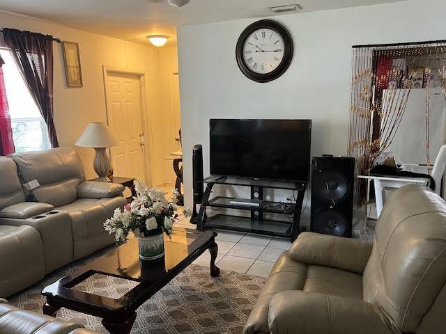 1164 NW 45th Ave, Lauderhill, FL 33313 - living area featuring light tile patterned floors