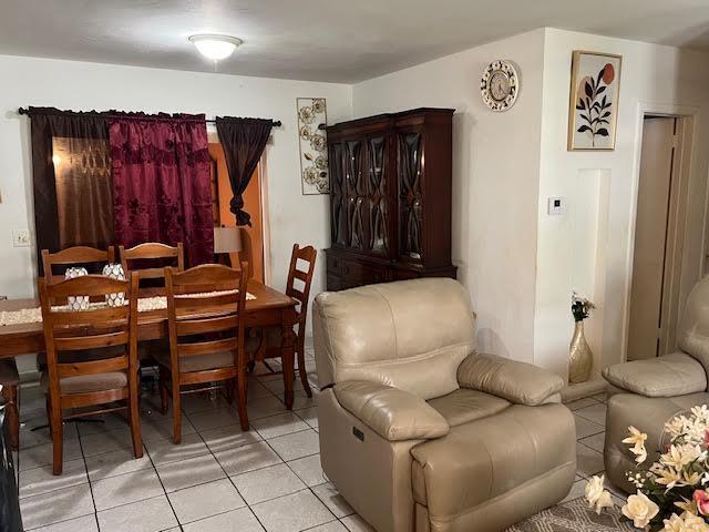 1164 NW 45th Ave, Lauderhill, FL 33313 - living area with light tile patterned floors