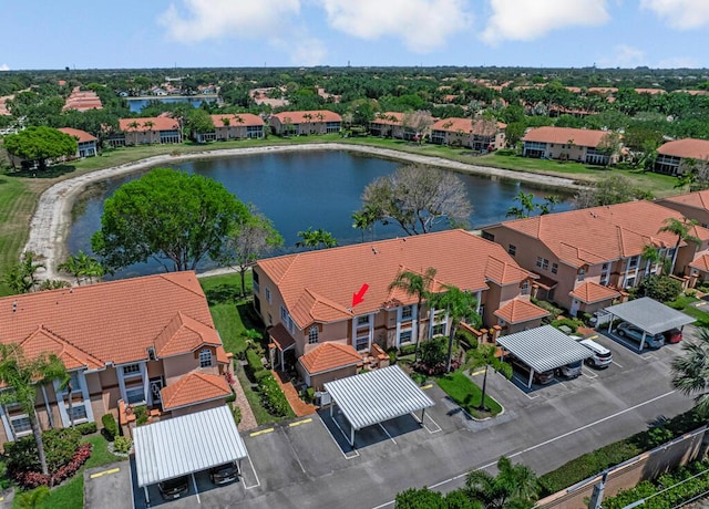 bird's eye view with a residential view and a water view