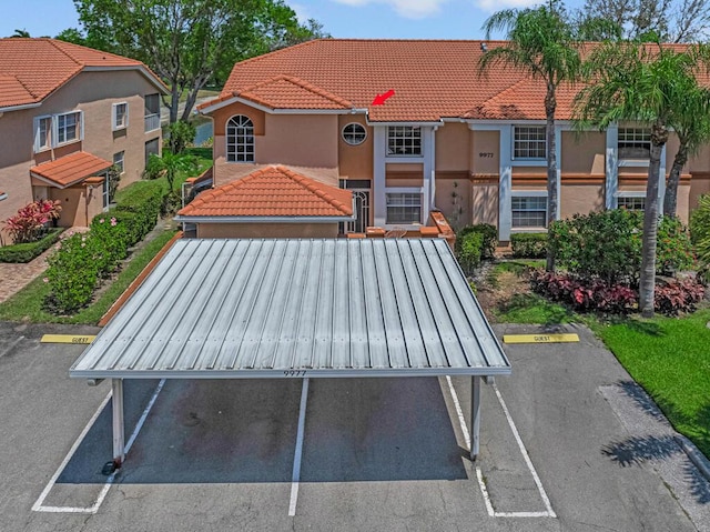 view of home's community featuring uncovered parking