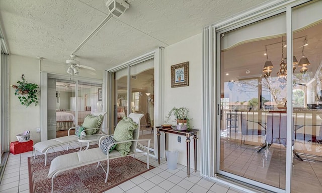 sunroom / solarium featuring ceiling fan and visible vents