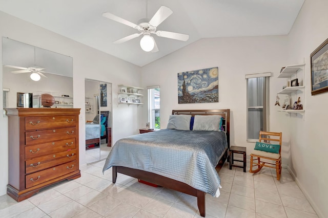 bedroom with a ceiling fan, light tile patterned flooring, and lofted ceiling