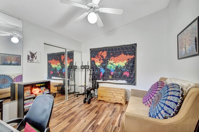 office area with wood finished floors, a ceiling fan, and vaulted ceiling