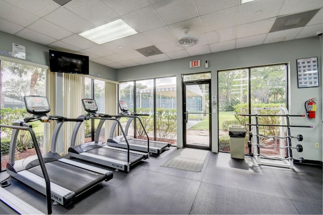 gym featuring a drop ceiling