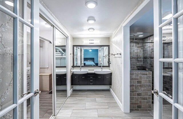 621 NW 71st Ave, Plantation, FL 33317 - bathroom with double vanity and tiled shower