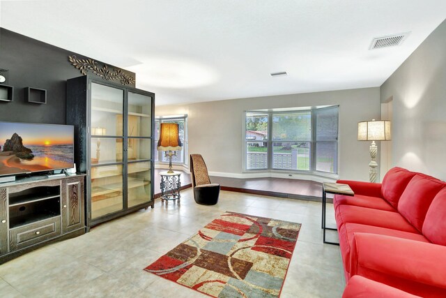 621 NW 71st Ave, Plantation, FL 33317 - living area featuring tile patterned flooring and baseboards