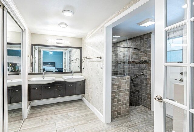 621 NW 71st Ave, Plantation, FL 33317 - bathroom with connected bathroom, walk in shower, double vanity, and baseboards