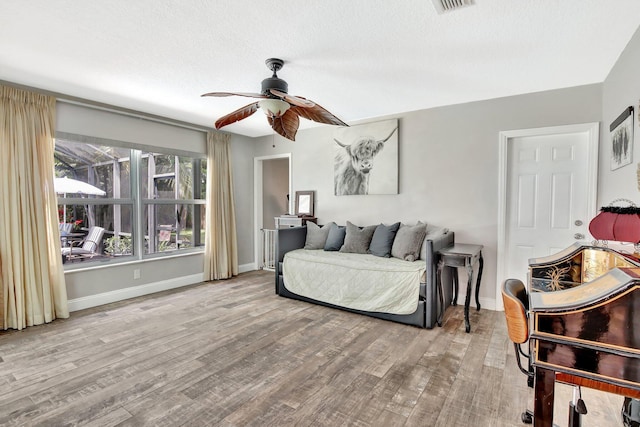 621 NW 71st Ave, Plantation, FL 33317 - bedroom with wood finished floors, baseboards, a ceiling fan, and a textured ceiling