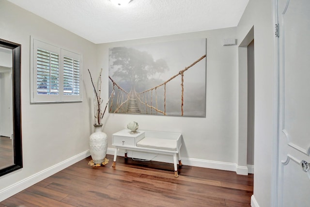 621 NW 71st Ave, Plantation, FL 33317 - detailed view of wood finished floors, baseboards, and a textured ceiling