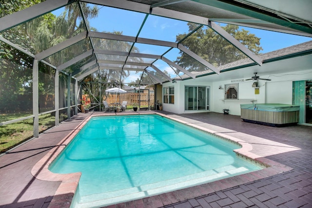 621 NW 71st Ave, Plantation, FL 33317 - view of pool with a hot tub, a patio, a fenced backyard, glass enclosure, and a ceiling fan