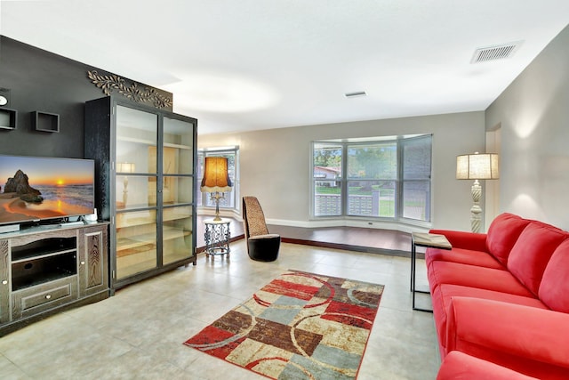 621 NW 71st Ave, Plantation, FL 33317 - living area featuring tile patterned floors and baseboards