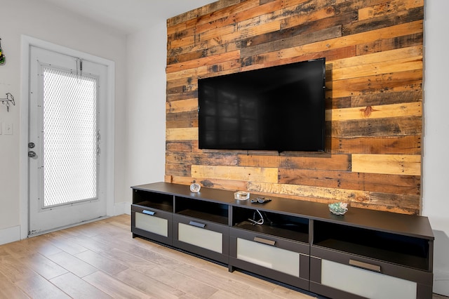 interior space with wood walls and wood finished floors