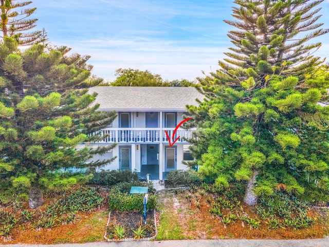 view of front of house with a balcony
