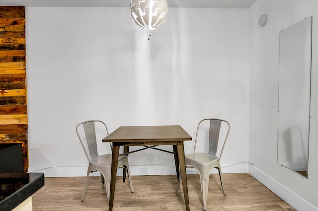 dining area with wood finished floors