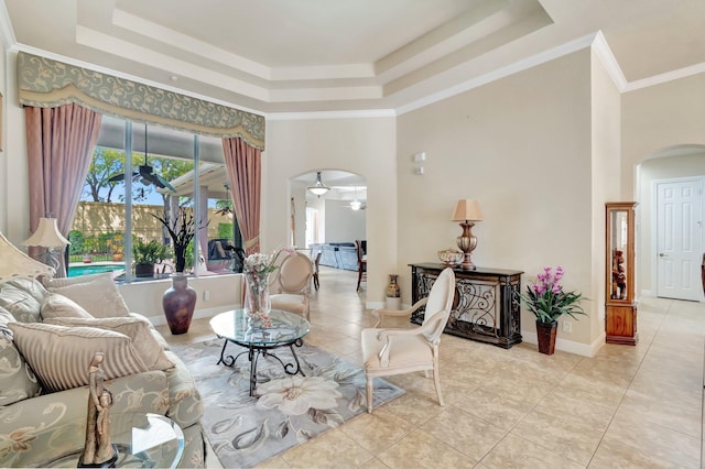 16211 Rosecroft Ter, Delray Beach, FL 33446 - living room with arched walkways, a tray ceiling, light tile patterned flooring, and a towering ceiling